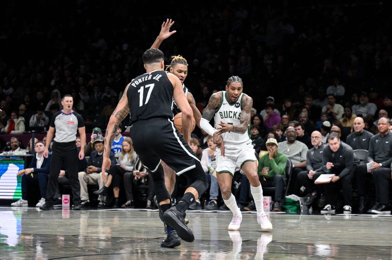 Bucks guard Kevin Porter Jr. loses control of the ball while being guarded by Nets forward Noah Clowney, middle, during the first half Dec. 14 at Barclays Center.