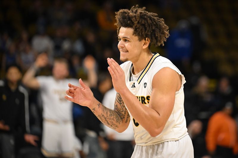 UW-Milwaukee freshman guard Stevie Elam celebrates one of his four first-half 3-point baskets against Indiana State in what was a breakout game before he suffered cramps due to his childhood kidney cancer.