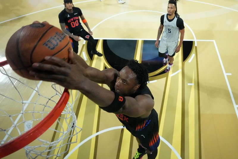 New York Knicks forward Og Anunoby (8) dunks the ball against the San Antonio Spurs during the Emirates NBA Cup Final at T-Mobile Arena in Las Vegas on Dec. 16, 2025.