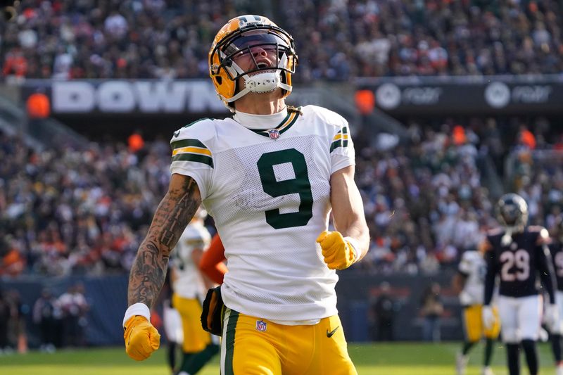 Nov 17, 2024; Chicago, Illinois, USA; Green Bay Packers wide receiver Christian Watson (9) celebrates a catch against the Chicago Bears during the second half at Soldier Field. Mandatory Credit: David Banks-Imagn Images