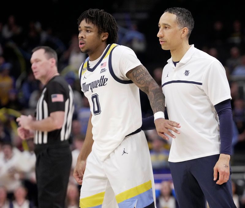 Marquette head coach Shaka Smart and guard Nigel James Jr. (0) are shown during the second half of their game Wednesday, December 17, 2025 at Fiserv Forum in Milwaukee, Wisconsin. Georgetown beat Marquette 78-69.