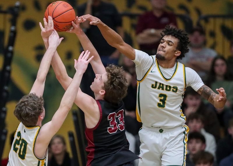 Ashwaubenon High School's Amari Allen (3) blocks a shot by De Pere High School's Pryce Gregoire (33) on Tuesday, February 4, 2025, at Ashwaubenon High School in Ashwaubenon, Wis. De Pere won the game, 70-68, on a Roan Demovsky layup with 1.6 seconds remaining in regulation.
Tork Mason/USA TODAY NETWORK-Wisconsin