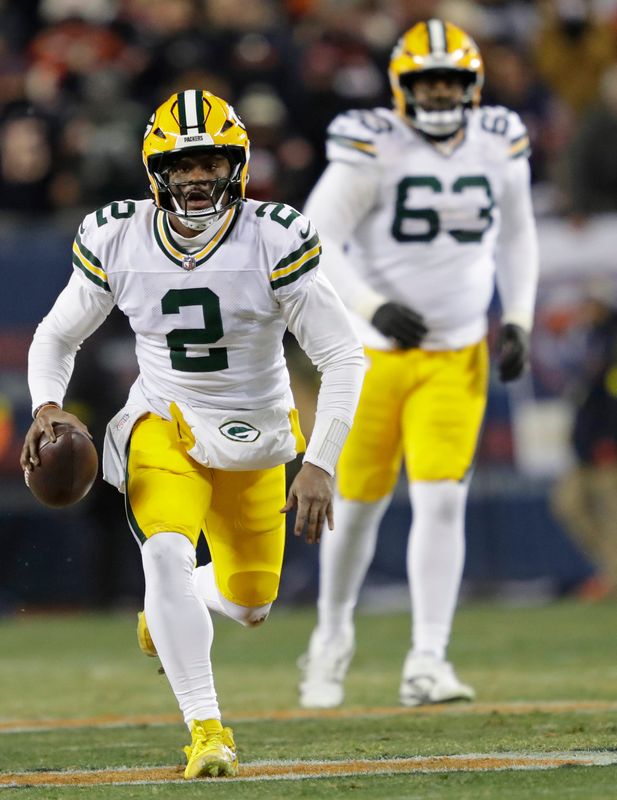 Green Bay Packers quarterback Malik Willis (2) runs for a gain against the Chicago Bears in the second quarter during their football game Saturday, December 20, 2025, at Soldier Field in Chicago, Illinois.