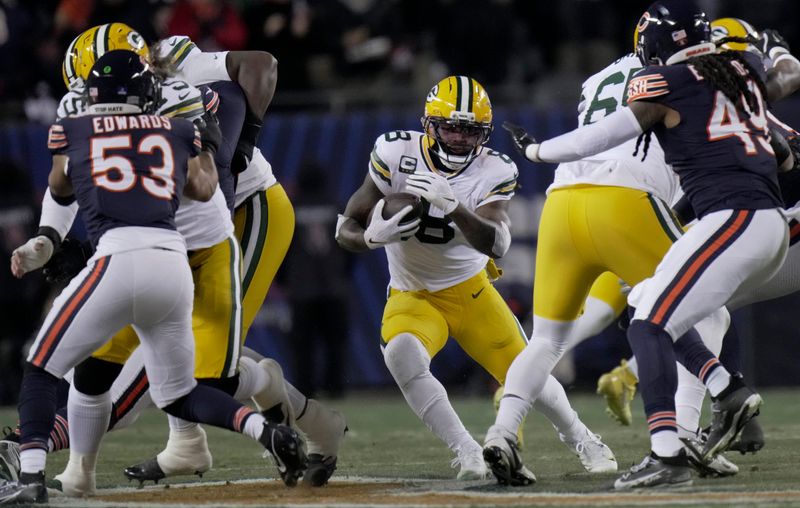 Green Bay Packers running back Josh Jacobs (8) finds a seam during the first quarter of their game against the Chicago Bears Saturday, December 20, 2025 at Soldier Field in Chicago, Illinois.
