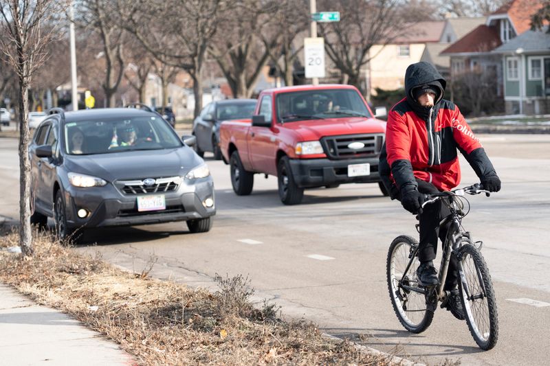 A cyclist approaches the intersections forming the “Bermuda Triangle,” along Forest Home Avenue, South 43rd Street and West Oklahoma Avenue, near Jackson Park.