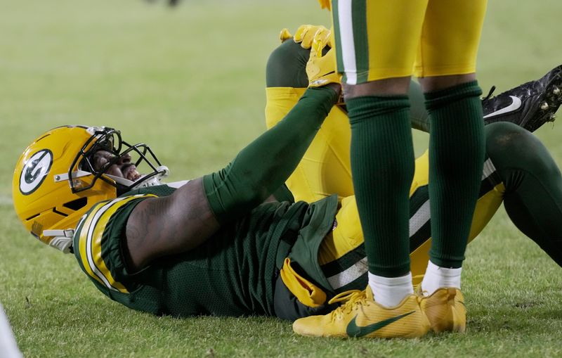 Green Bay Packers cornerback Nate Hobbs (21) is injured during the second quarter of their game against the Baltimore Ravens Saturday, December 27, 2025 at Lambeau Field in Green Bay, Wisconsin.