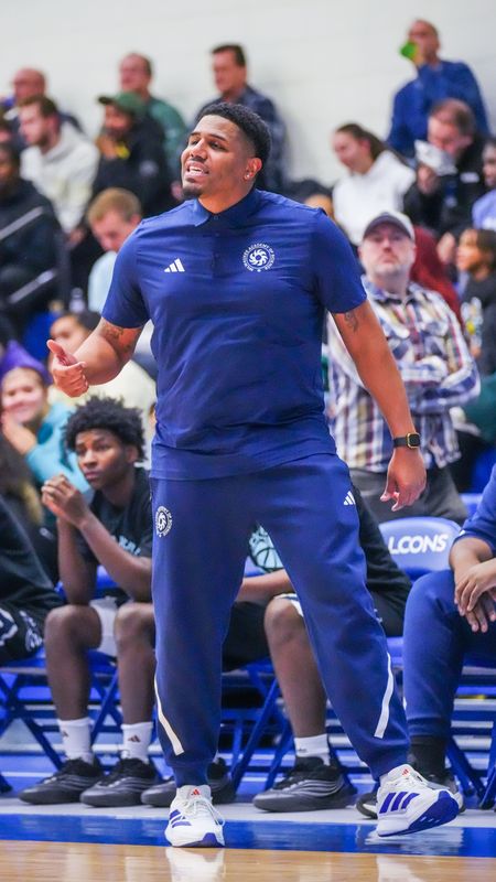 Milwaukee Academy of Science boys basketball head coach Raymont McElroy gestures from the sideline during the game against De Pere in the Rick Majerus WBY Shootout on Monday, Dec. 29, 2025, at Concordia University in Mequon, Wisconsin. De Pere won the game, 84-81.