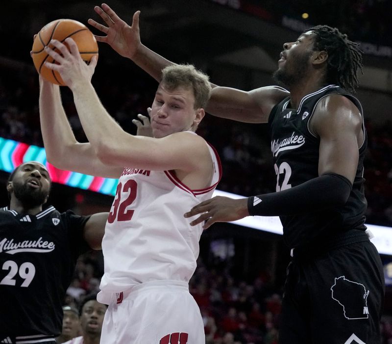 Wisconsin forward Aleksas Bieliauskas (32) out rebounds UW-Milwaukee forward Faizon Fields (22) during the first half of their game Tuesday, December 30, 2025 at the Kohl Center in Madison, Wisconsin.