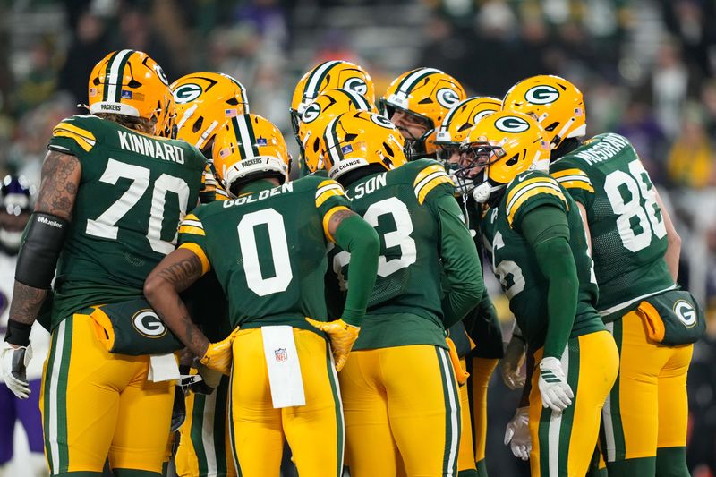 Dec 27, 2025; Green Bay, Wisconsin, USA; The Green Bay Packers huddle during the fourth quarter against the Baltimore Ravens at Lambeau Field. Mandatory Credit: Kayla Wolf-Imagn Images
