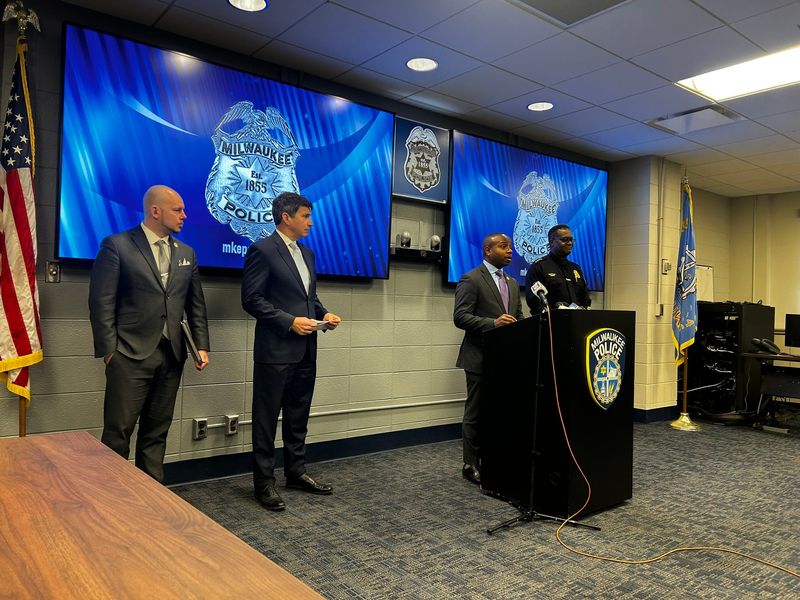 Adam Procell, director of the city's Office of Community Wellness and Safety; District Attorney Kent Lovern; Mayor Cavalier Johnson and Police Chief Jeffrey Norman speak on 2025 crime statistics at the Milwaukee Police Administration Building on Jan. 8.