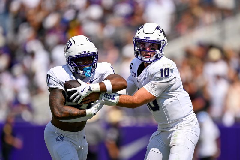 Sep 20, 2025; Fort Worth, Texas, USA; TCU Horned Frogs quarterback Josh Hoover (10) hands the ball off to running back Nate Palmer (21) during the game between the TCU Horned Frogs and the SMU Mustangs at Amon G. Carter Stadium. Mandatory Credit: Jerome Miron-Imagn Images