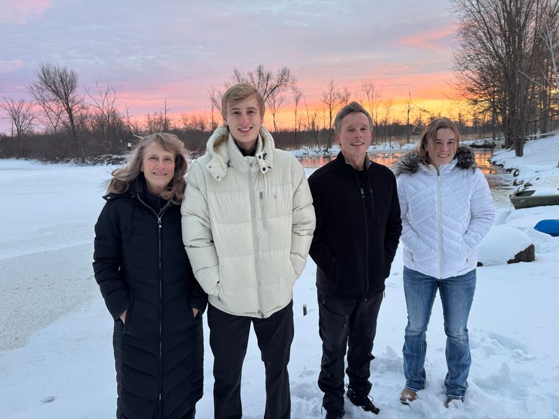 Jane, Jordan, Dirk and Hannah Stolz, at the pond in their yard in December, 2025. The whole family learned to skate here 16 years ago.