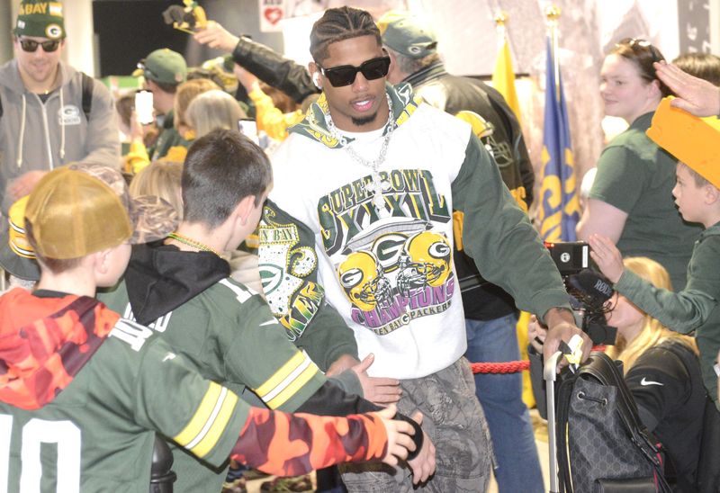 Green Bay Packers players and staff run a friendly gauntlet on Jan. 9, 2026, at Green Bay Austin Straubel International Airport, Ashwaubenon. The Packers play the Chicago Bears in an NFC wild-card playoff game on Jan. 10, 2026, at Soldier Field in Chicago.