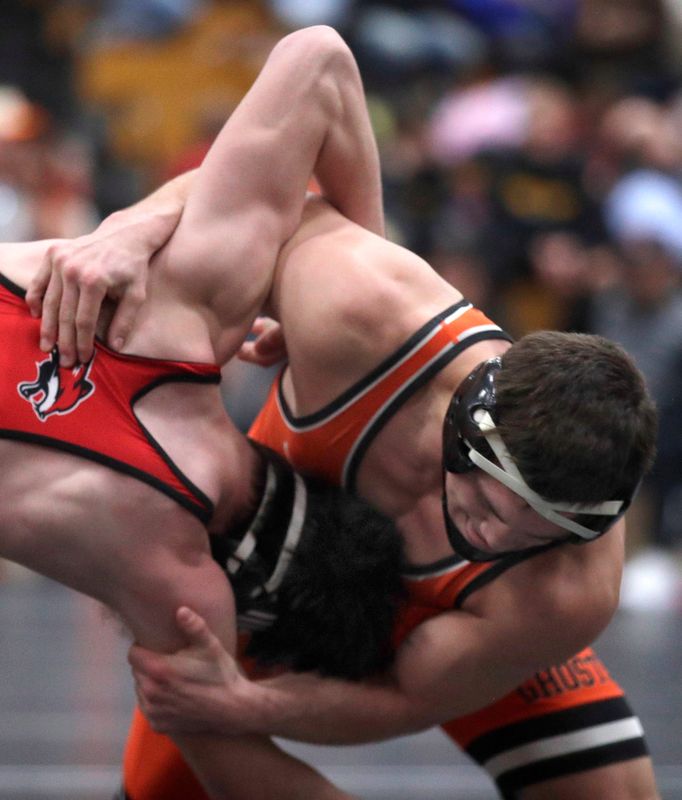 Kaukauna’s Liam Crook, right, wrestles Yorkville’s Josh Stockl in a 175-pound match during the Cheesehead Invitational in Kaukauna. Crook finished with a career record of 197-8.