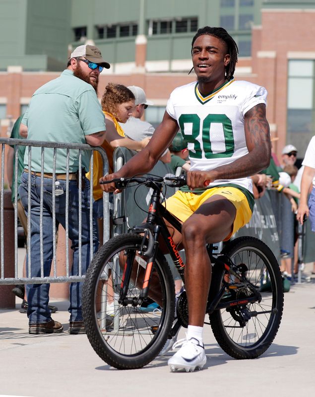 Green Bay Packers wide receiver Isaiah Neyor (80) participates in the Dream Drive bicycle ride before practice on Aug. 7, 2025, in Green Bay, Wis.