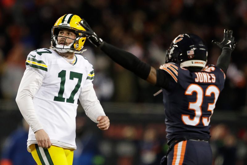 Green Bay Packers kicker Brandon McManus reacts to missing a field goal late in the fourth quarter as Chicago Bears cornerback Jaylon Jones celebrates.