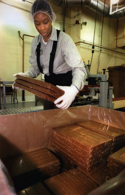 Karen Ingram packages blocks of milk chocolate at Ambrosia Chocolate Company in April, 1994.