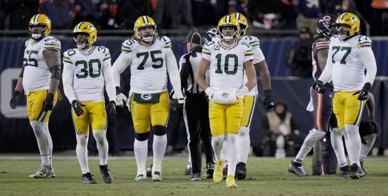 Green Bay Packers quarterback Jordan Love (10) is shown with guard Aaron Banks (65), running back Chris Brooks (30), guard Sean Rhyan (75) and guard Jordan Morgan.