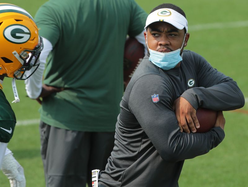 Then-Green Bay Packers defensive quality control coach Christian Parker coaches in 2020 during the team's training camp.