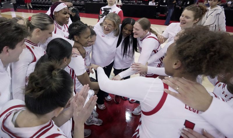 Wisconsin head coach Robin Pingeton is show with her team after their overtime win Sunday, January 18, 2026 at the Kohl Center in Madison, Wisconsin. Wisconsin beat Oregon 94-92 in double overtime.