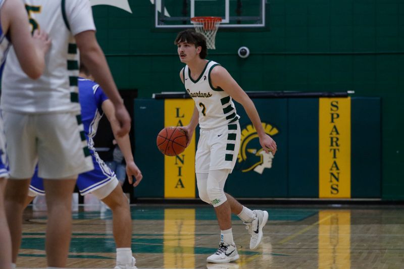 Laconia's Cash Farrell dribbles the ball against Winnebago Lutheran at Laconia High School on Thursday, Jan. 22, 2026. Laconia defeated Winnebago Lutheran, 80-66, in overtime.