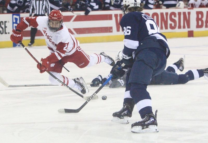Wisconsin's Luke Osburn loses his footing during the first period of a 7-2 loss to No. 8 Penn State Friday Jan. 23 at the Kohl Center in Madison, Wis.