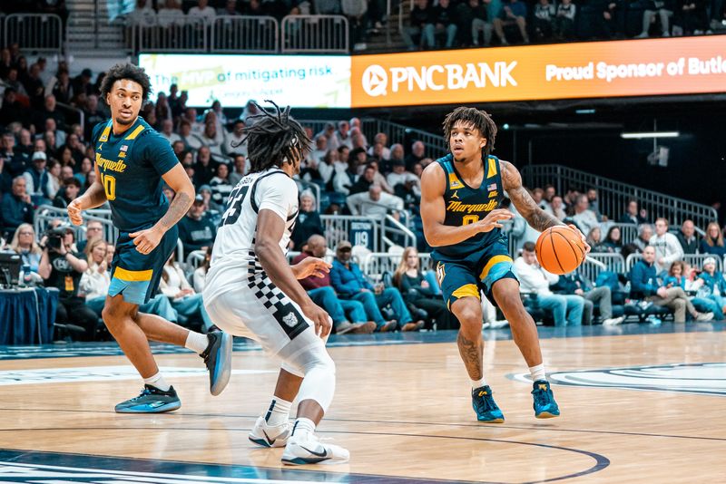 Marquette's Nigel James Jr. and Adrien Stevens look for room to operate against Butler on Jan. 23.
