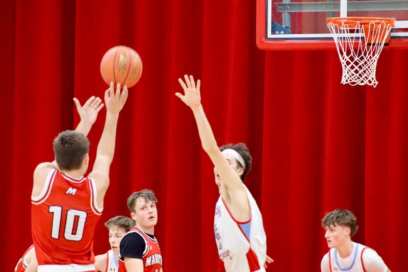 Marathon senior Drew Woelfel shoots a jumpsuit at Newman Catholic High School on Tuesday, January 27, 2026. Marathon beat Newman Catholic 68-47 (Alfred Smith III/ Wausau Daily Herald).