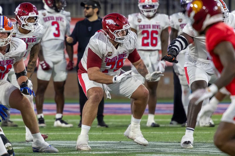 Offensive lineman Fernando Carmona (79) of Arkansas blocks during practice.