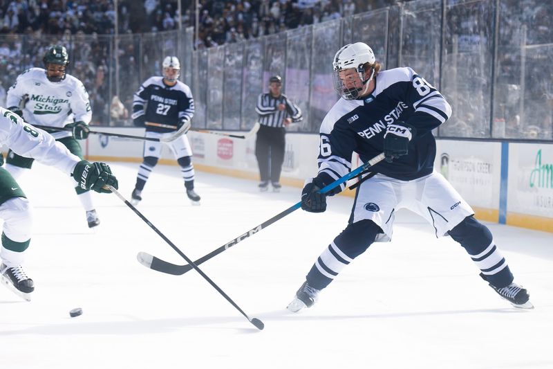 Penn State forward JJ Wiebusch (86) passes the puck during a Big Ten ice hockey game against Michigan State in Beaver Stadium on January 31, 2026.