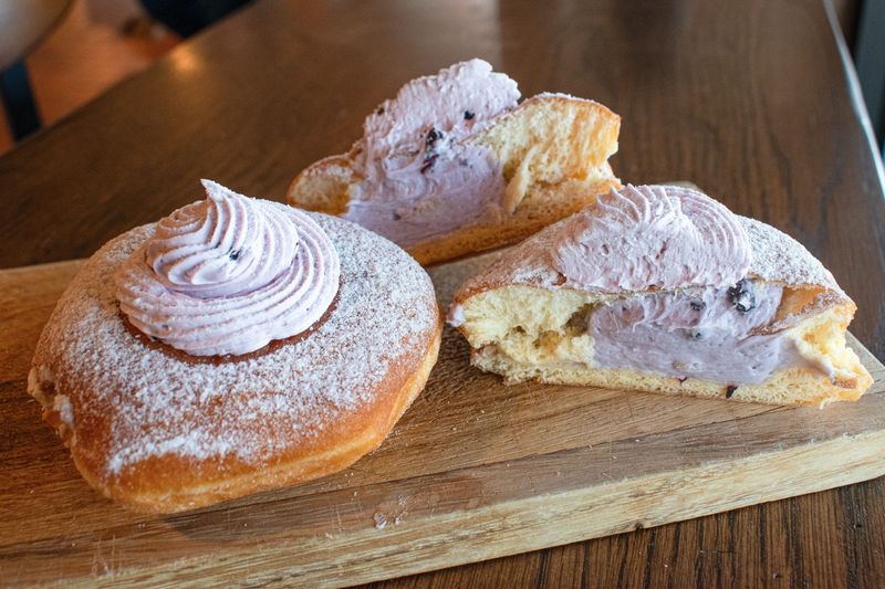 O&H Danish Bakery offers 10 flavors of paczki, including the new blueberry cheesecake topped with powdered sugar and blueberry buttercream, available at stores in Oak Creek, Racine and Sturtevant.