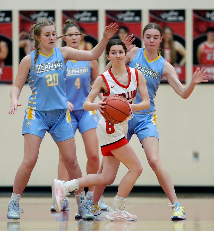 Brillion High School's Alana Kempen (5) is under heavy pressure from St. Mary Catholic High School's Paxtyn Trinkner (20), Halle Janssen (4) and Audrey Weber (11) during their girls basketball game Monday, February 2, 2026, in Brillion, Wisconsin. St. Mary Catholic won 69-39.