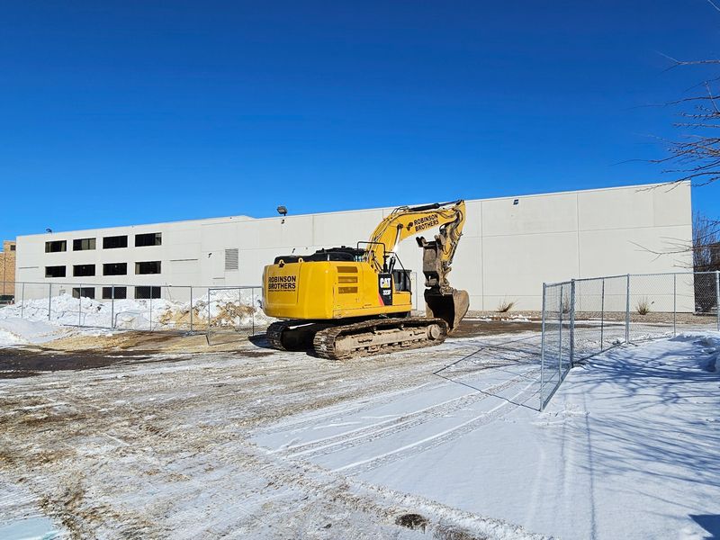 Equipment and fencing owned by demolition company Robinson Brothers Environmental Inc. surrounds the building as interior demolition work on 1039 Ellis Street began in January 2026.