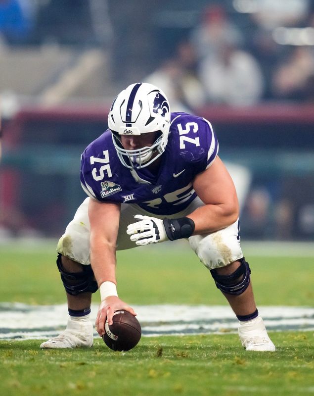 Dec 26, 2024; Phoenix, AZ, USA; Kansas State Wildcats offensive lineman Sam Hecht (75) against the Rutgers Scarlet Knights during the Rate Bowl at Chase Field. Mandatory Credit: Mark J. Rebilas-Imagn Images
