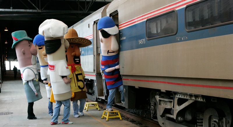 The Milwaukee Brewers Racing Sausages prepare to board an Hiawatha Amtrak train at Milwaukee's Intermodal station on Feb. 12, 2009, as part of a special promotion promoting trips to Chicago for Brewers-Cubs games.