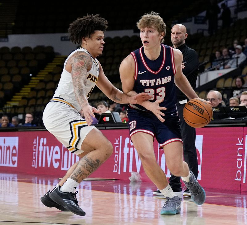 UW-Milwaukee guard Stevie Elam pressures Detroit Mercy guard TJ Nadeau during their first meeting of the season Feb. 4 at the UWM Panther Arena.