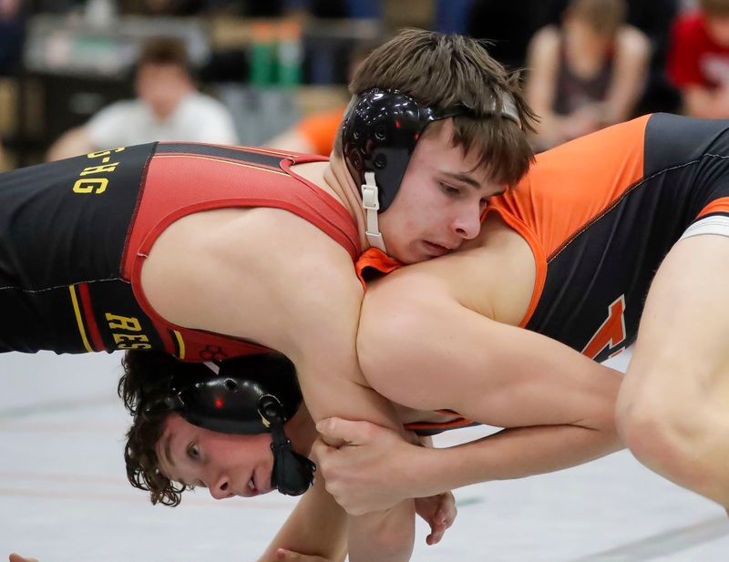 Elkhart Lake-Glenbeulah’s Carter McCall, top, grips Cedar Grove-Belgium’s Chase Heimerman in a 113-pound match during the Big East Conference wrestling championships, Friday, February 6, 2026, in Cedar Grove, Wis.