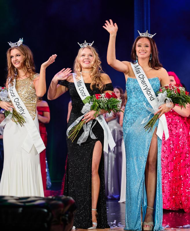 Waving to the audience during the 2026 Miss Door County Scholarship Organization pageant Feb. 7 at Southern Door Community Auditorium are, from left, Kaylee Griep, the newly crowned Miss Door County; Mia Glocke, the new Miss Door County's Teen; and Paige Nikodem, the new Miss Cherryland.