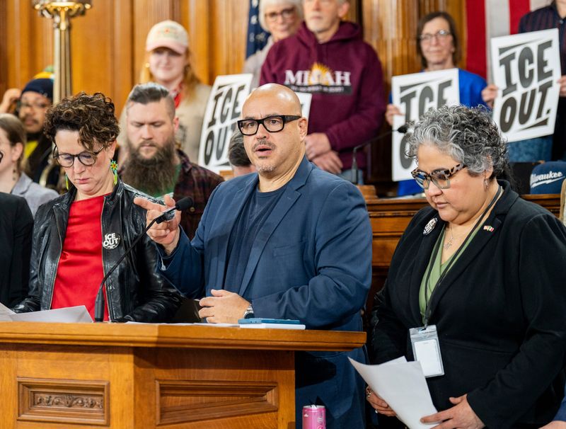 Milwaukee Common Council President Jose Perez, center, speaks as Milwaukee Common Council members announce a package of legislation aimed at limiting federal immigration operations in the city. The announcement took place at the Common Council chamber at City Hall on February 11, 2026, in Milwaukee, Wisconsin.