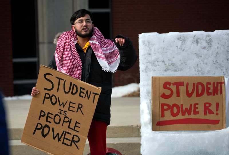 Faiz Ahmad, sophomore at University of Wisconsin- Milwaukee, speaks at a protest on Feb. 12 in Milwaukee. He and other students were protesting UWM's decision to consolidate 8 student centers on campus. "They've (centers) been a cultural safe space for multiple students. This makes me sad," said Ahmad.