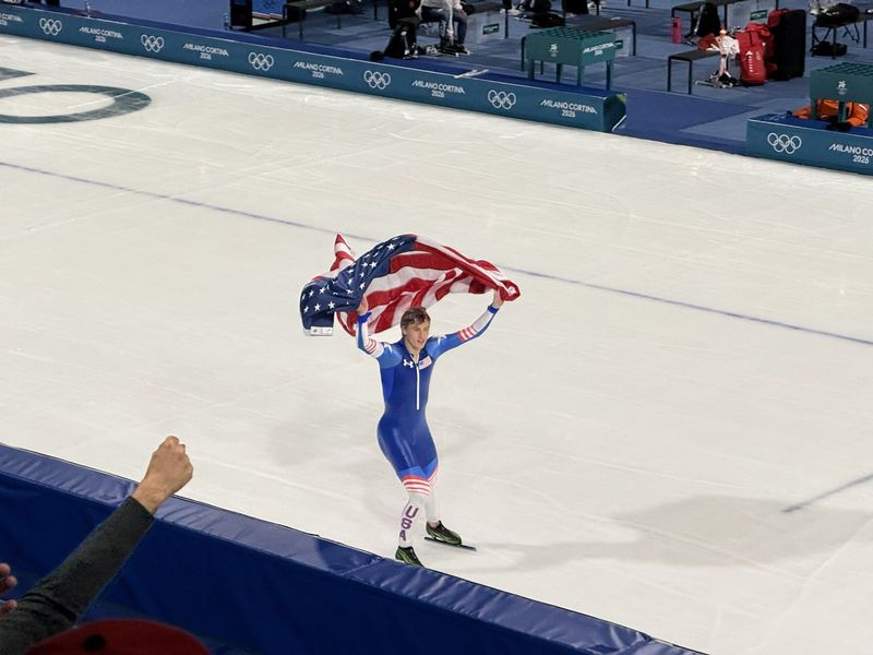 Kewaskum's Jordan Stolz, 21, parades around the Milano Speed Skating Stadium in Milan, Italy, after winning gold in the 500 meters, his second gold medal of the 2026 Winter Olympics, on Feb. 14, 2026.