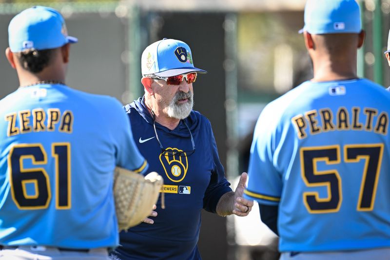 Nashville Sounds manager Rick Sweet talks with pitchers Angel Zerpa and Sammy Peralta during spring training workouts Saturday, February 14, 2026, at American Family Fields of Phoenix in Phoenix, Arizona.