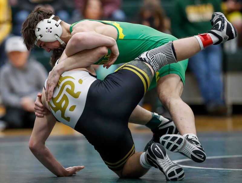 Green Bay Preble High School’s Maximus Davis takes down Green Bay United’s Luke Rissling in a 165-pound quarterfinal match during a WIAA sectional wrestling meet on Saturday, February 14, 2026, at Green Bay Preble High School in Green Bay, Wis. 
Tork Mason/USA TODAY NETWORK-Wisconsin