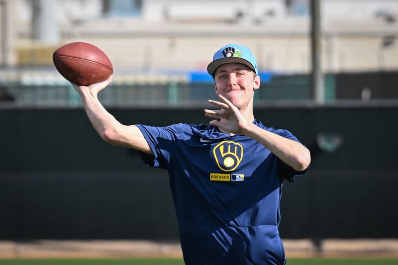 Milwaukee Brewers pitcher Jacob Misiorowski tosses a football during spring training workouts Sunday, February 15, 2026, at American Family Fields of Phoenix in Phoenix, Arizona.