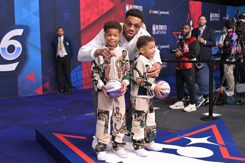 Feb 15, 2026; Los Angeles, CA, USA; Team World forward Giannis Antetokounmpo (34) of the Milwaukee Bucks poses with his children Liam Antetokounmpo and Maverick Shai Antetokounmpo on the red carpet before the 75th NBA All Star Game at Intuit Dome. Mandatory Credit: Jayne Kamin-Oncea-Imagn Images