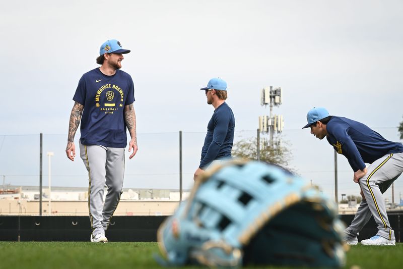 Milwaukee Brewers infielder Brice Turang (2) stenches with a group of players during spring training workouts Monday, February 16, 2026, at American Family Fields of Phoenix in Phoenix, Arizona.