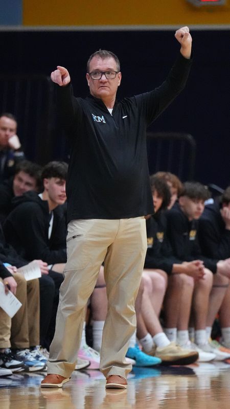 Kettle Moraine boys basketball head coach Brian Richert calls in a play during the game against Milwaukee Vincent at Kettle Moraine High School in Wales, Wisconsin, Feb. 16, 2026. Kettle Moraine won the game, 85-40.