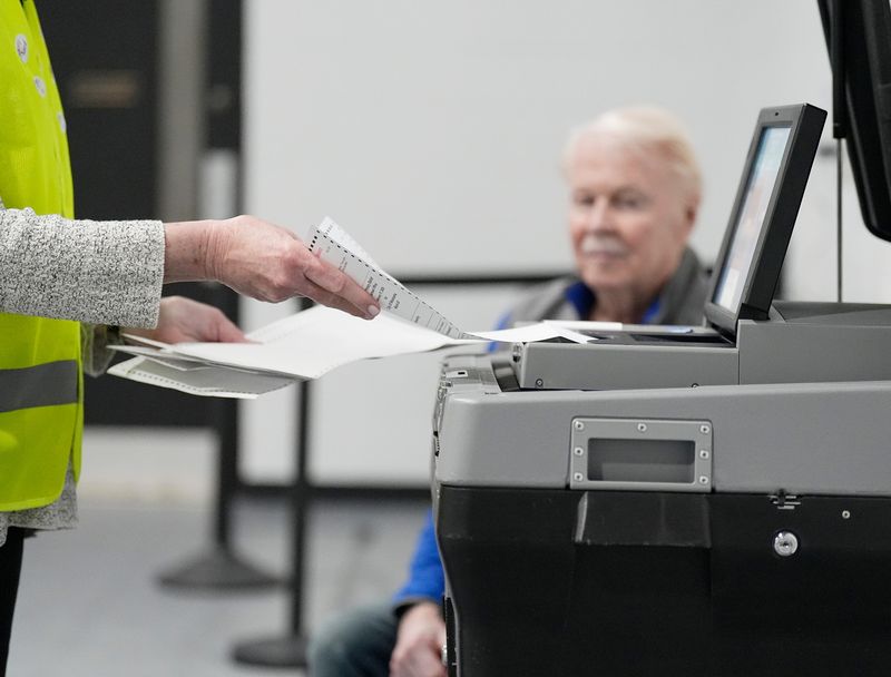 Absentee ballot processor Toni Schnorr processes absentee ballots for the primary election for the District 13 Aldermanic Race at the District 13 polling location in the Northview Building on Tuesday February 17, 2026 in Waukesha, Wisconsin.