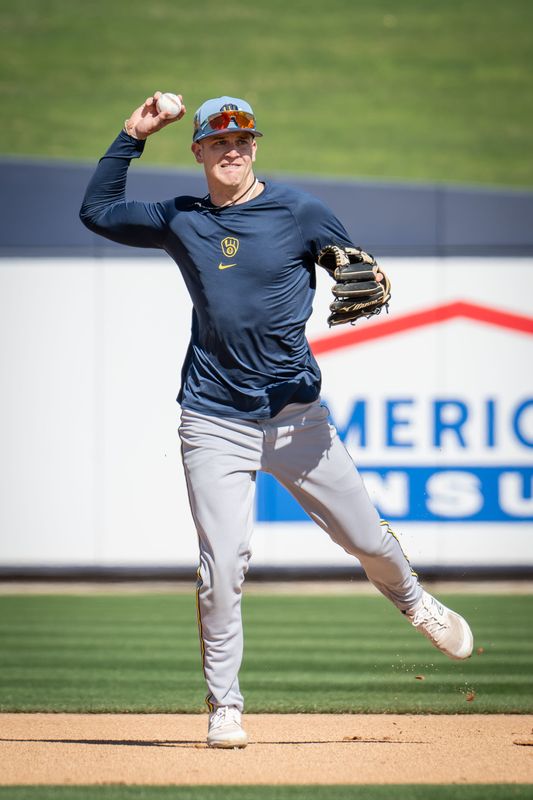 Milwaukee Brewers infielder Cooper Pratt throws to the ball during spring training workouts Tuesday, February 17, 2026, at American Family Fields of Phoenix in Phoenix, Arizona.