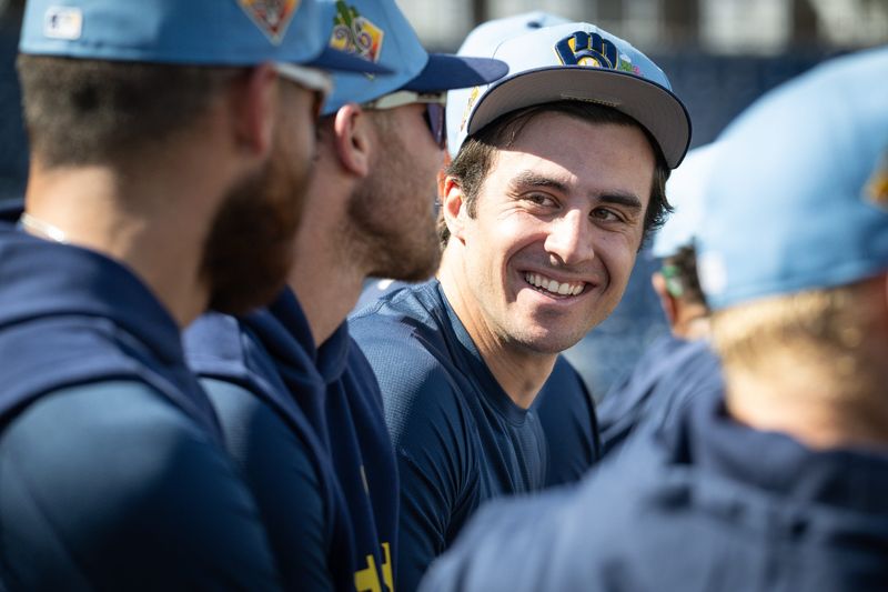 Milwaukee Brewers outfielder Sal Frelick talks with teammates during spring training workouts Tuesday, February 17, 2026, at American Family Fields of Phoenix in Phoenix, Arizona.